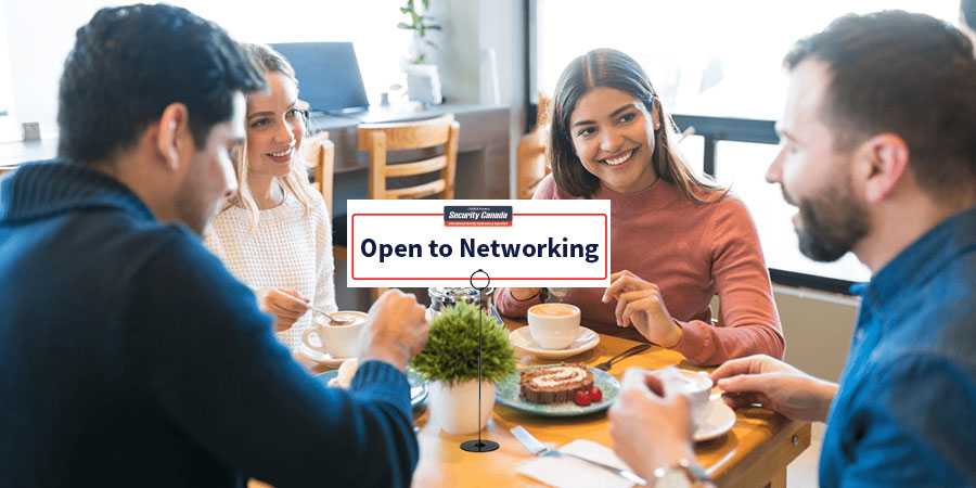 Cafeteria Table with an "Open to Networking" sign
